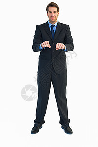 商务人士当着他的面举起紧握的拳头职业头发蓝色棕色短发公司夹克男性领带微笑图片