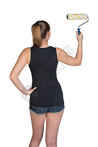 妇女使用涂漆滚滚短裤工作室装修工具女性绘画照片黑色单线长发图片