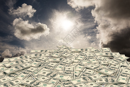 摆放美元成堆成堆美元的复合图象经济天空多云财富银行业货币金融阳光背景