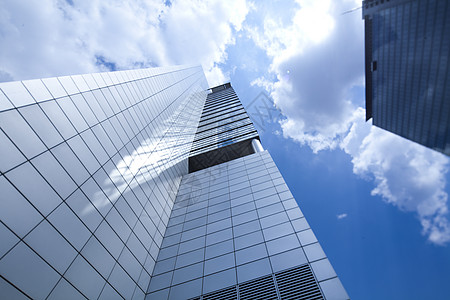 商业建设中心 自然色彩多彩的音调摩天大楼办公室天空反射建造建筑学金融地面蓝色组织图片