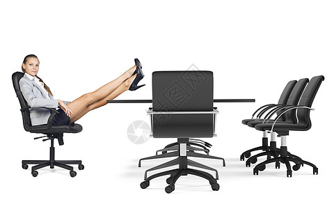 女商务人士坐在椅子上 她的双腿交叉放在桌子上夹克商务人士白色裙子高跟鞋图片