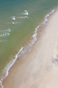 泰国的海滩海岸天堂天空海洋叶子棕榈悬崖椰子太阳冲浪图片