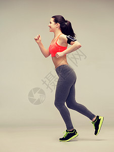 运动妇女跑步或跳跃空气臂章身体行动运动装力量女孩拉丁重量手臂图片