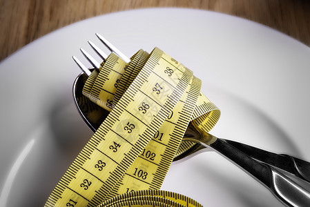 以叉子勺子和叉子盒录磁带器节食观察者空闲胶带食物盘子纪律饮食停留重量图片