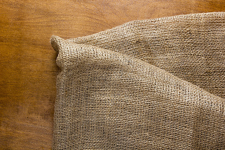 由旧麻布制成的背景桌子纺织品布料帆布解雇组织套袋纤维地面木头背景图片