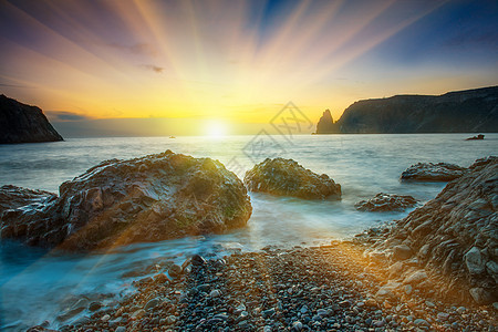 海滩日落天空海岸场景紫色海浪晴天反射支撑地平线太阳图片