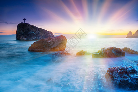 海滩日落季节晴天天空地平线天气海岸岩石反射海浪海景图片