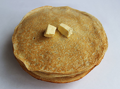 盘子上的黄油煎饼是古代斯拉夫嘉年华庆典的象征国家蛋糕夫人节日活动民众电线繁殖力饶恕欢乐图片