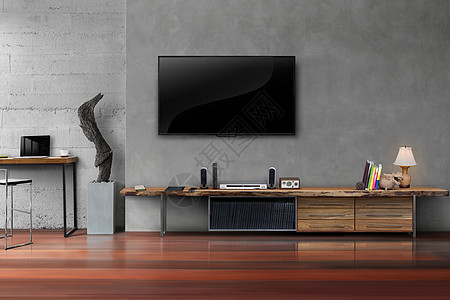 混凝土墙上的 Led 电视与客厅的木桌图片