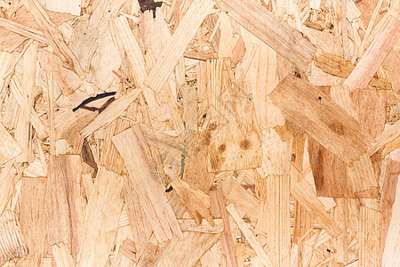 定向刨花板 OS 的特写纹理导向筹码盘子粒子木头木材松树锯末地面碎片背景图片