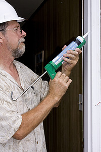 锁门承包商绿色空气腐烂环境填缝工人男人养护房子图片