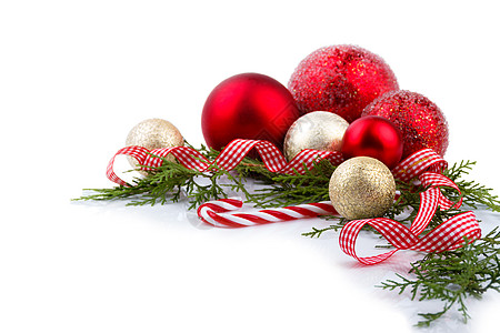 圣诞节装饰概念绿色假期装饰品金子白色蜡烛框架红色丝带植物图片