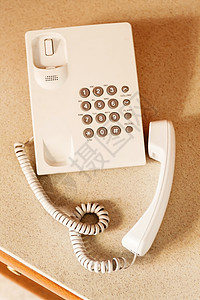 白色有线电话按钮 顶视图电缆黑色桌子数字商业办公室通讯拨号展示手机图片