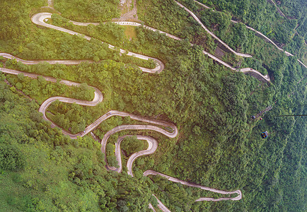 天门山zhan带绕风和弯曲路的电缆车旅游旅行公园石头悬崖高架森林技术索道农村图片