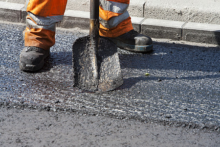 道路工人运动黑色工作服铺路工作靴橙子职业沥青动者修复图片