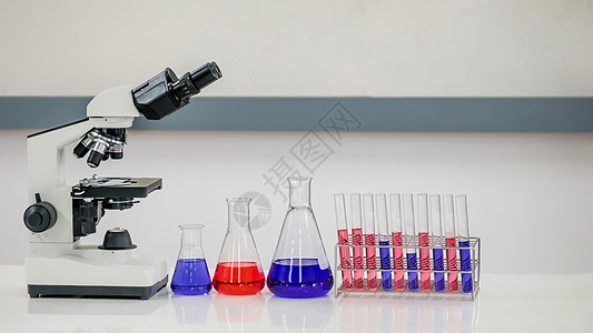 实验室测试管女性蓝色液体工具化学专家医生解决方案生物科学图片