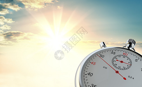 日出背景下的模拟站表太阳日落码表手表计时射线圆圈光束成就时间背景图片