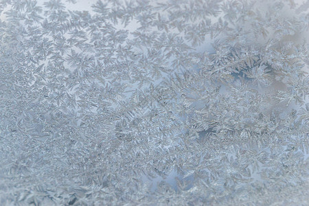 冷冻窗口大蓝色微光雪花结晶季节磨砂窗户天气玻璃火花图片
