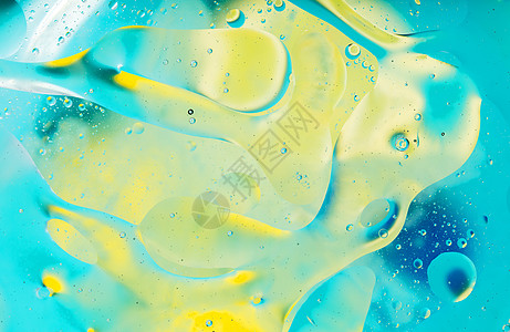 水面上的彩色斑点圈背景辉光气泡火花魔法黄色圆圈宏观玻璃白色图片