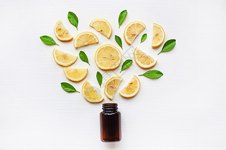空药瓶加新鲜柠檬片和叶子框架水果食物圆圈热带橙子柠檬生长果汁团体图片