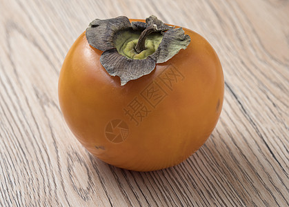 木制背景的全熟百草枯水果情调饮食甜点小吃食物异国季节柿子橙子营养图片