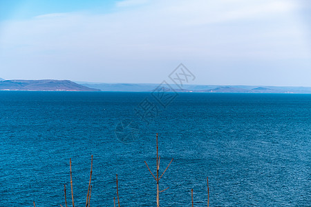 来自海参松市的阿穆尔湾景象港口全景旅行运输天空摩天大楼货物起重机中心车站图片