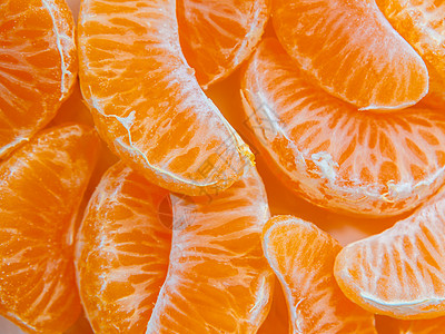 几片磨熟成熟的普通话切片 纹理背景养分饮食黄色水果热带团体食物橘味营养图片