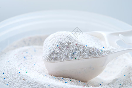 含杯量的洗粉粉粉末卫生洗衣店测量生活杯子白色设施塑料颗粒剂图片