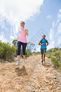 搭配的一对有吸引力的情侣在山脚下慢跑的复合图像男性风景微笑监控女性电脑夫妻活动荒野蓝色图片