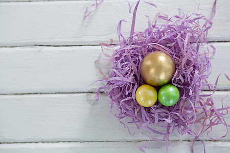 金色复活节彩蛋 两个在巢里涂满的鸡蛋娱乐手机野兔季节收藏挑战纪念品耐力庆典假期图片