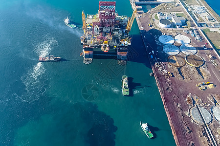 海上钻井平台港口的钻井平台 石油平台的拖车勘探汽油管道橙子血管钻头钻孔工程起重机活力背景