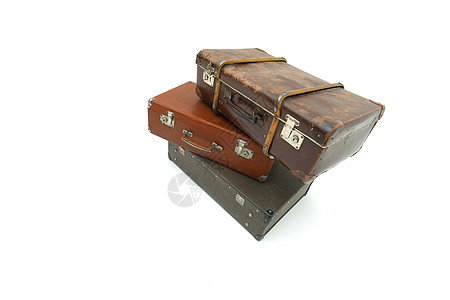 白色背景上的旧套件 孤立照片苦恼古董旅游行李殴打棕色黄色假期旅行图片