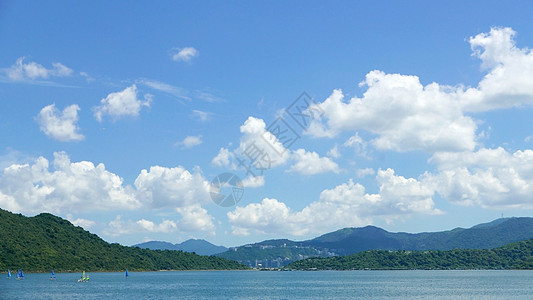 游水运动 吹风 蓝天空和白云蓝色季节风景航行假期云景环境戏剧性活动冲浪图片