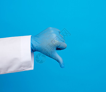 穿着白大衣的医生用按钮显示一种不喜欢的手势w手指护士助手诊所药品科学医院职业女士蓝色图片