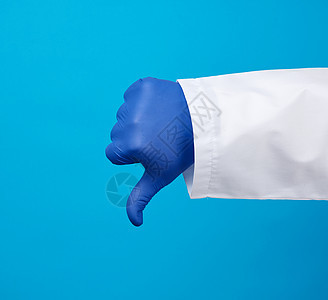 穿着白大衣的医生用按钮显示一种不喜欢的手势w男性卫生蓝色情感失败治疗保健手套护士成人图片