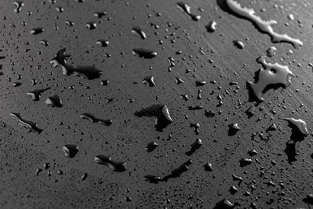 湿黑疏水表面的抽象背景选择性聚焦特写湿度天气摄影反射潜水水滴墙纸斑点绝缘液体图片
