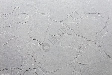 抽象的白色不显眼的背景和纹理 新旧裂缝层下的石膏墙图片
