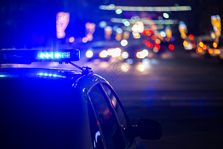 夜间巡逻夜间警察车灯在城市 有选择性地聚焦和bokeh犯罪救护车车辆危机命令背景汽车帮助场景服务背景