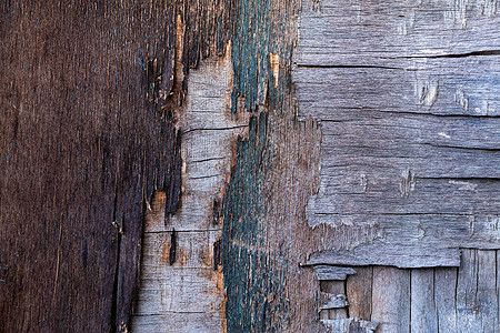 旧的毁坏胶合板板材特写表面纹理乡村面板垃圾裂缝控制板木头硬木粮食木板悲伤图片