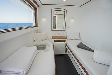 豪华私人游艇客厅乐趣聚光灯卧室木头奢华海景航行工艺血管床单图片