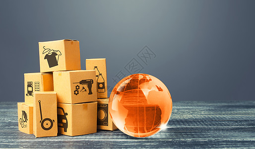 橙色玻璃地球仪和盒子 国际世界贸易分布 货物的交付 运输 全球化市场 经济发展 全球经济 进出口货运量图片