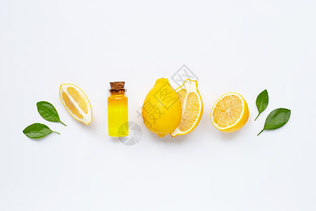 新鲜柠檬与柠檬精油在惠特饮食水果团体橙子植物菠萝热带果汁排毒食物背景图片
