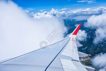 翅膀的图像平面蓝色阴影喷射运输商业天空气氛白色土地窗户图片