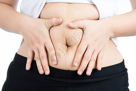 胖女人拿着过多的脂肪腹部 超重的脂肪腹部在白色背景下被隔离 饮食生活方式 减肥 胃肌 健康理念身体女性损失数字肚子组织检查腰部肥图片