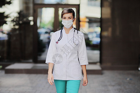 戴面罩保护面具的女医生或护士Covid19保健概念口罩卫生感染女性防护家庭医生药品女孩专家安全背景