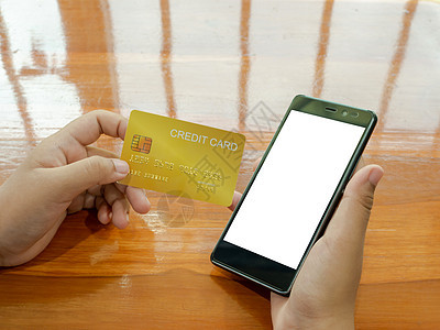 网上购物概念 人手持智能电话和手机购物电子商务女士金融支付卡片电脑客户零售店铺图片