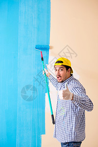 在家里画墙的油漆工滚筒刷子绘画建设者画笔工人职业房间画家公寓图片