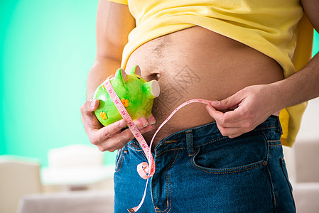 在饮食概念中用胶带量度衡量人体脂肪的人检查食欲食物测量腰部身体肚子肥胖厘米锻炼图片