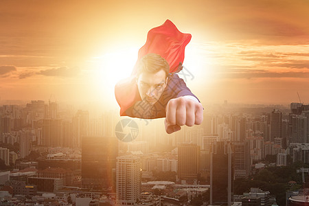 超级英雄商务人士飞过城市上空大男子飞行队长乐趣力量商务帮助领导者老板人士图片