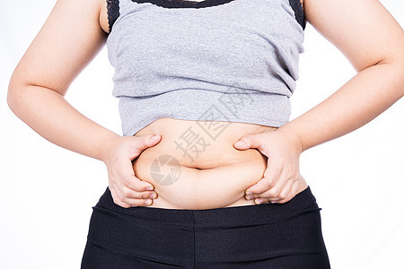 胖女人拿着过多的脂肪腹部 超重的脂肪腹部在白色背景下被隔离 饮食生活方式 减肥 胃肌 健康理念肚子损失腰部展示肥胖身体尺寸重量烧图片